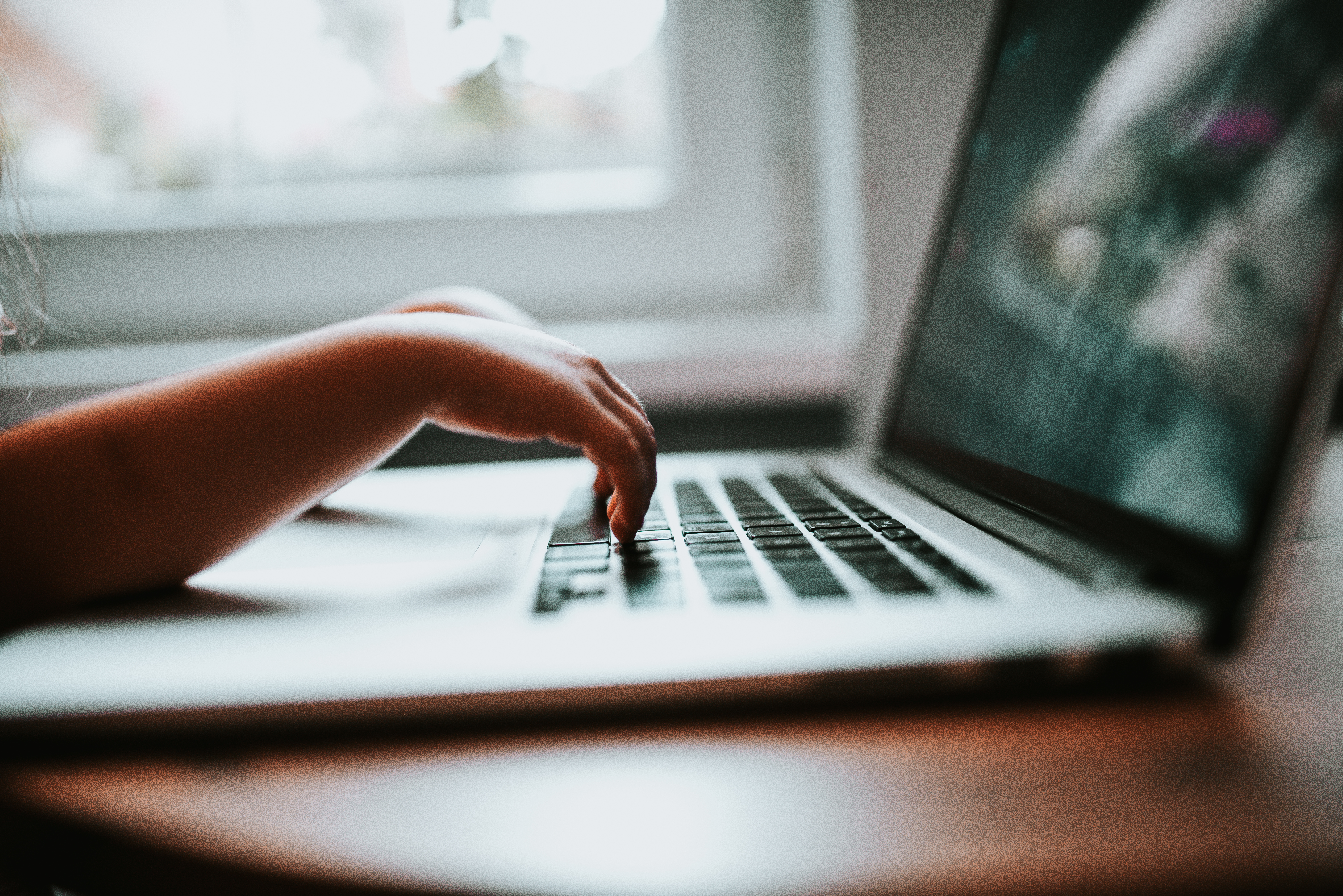 "Children's learner typing on the laptop keyboard closeup" by Nenad Stojkovic, available at https://www.flickr.com/photos/156445661@N02/50127168191, licensed under CC BY 2.0